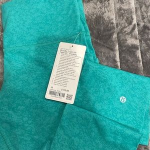 LULULEMON WUNDER TRAIN HR TIGHT 25” PKTS BZMV